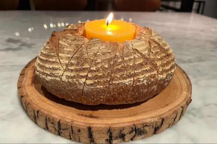 edible butter candle melting in a dish