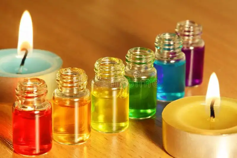 essential oils in colored bottles on table