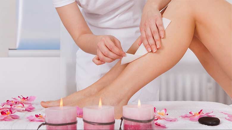 woman getting a leg wax with soft wax