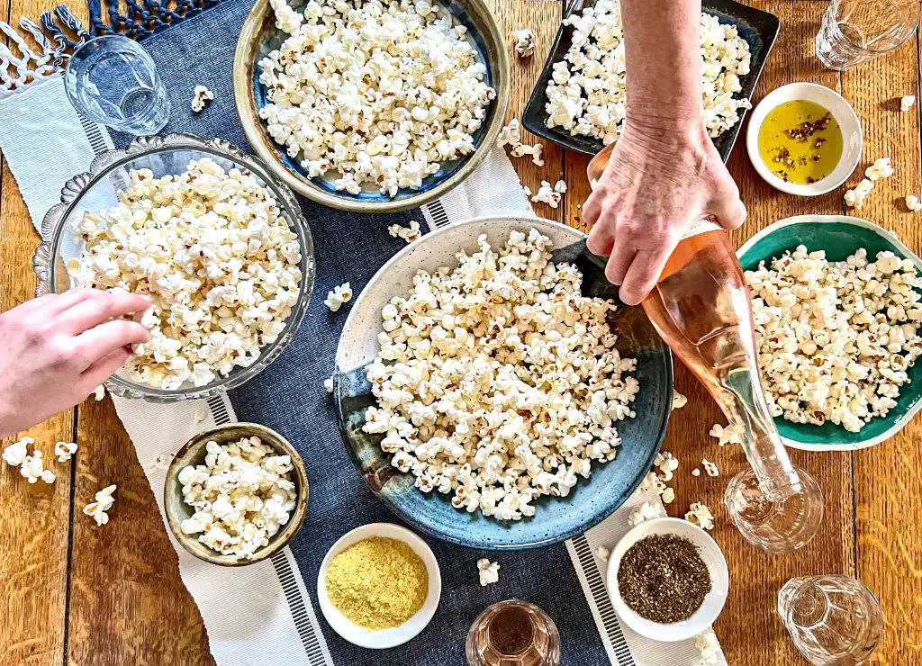 a bowl of freshly popped popcorn at home brings feelings of warmth and comfort.