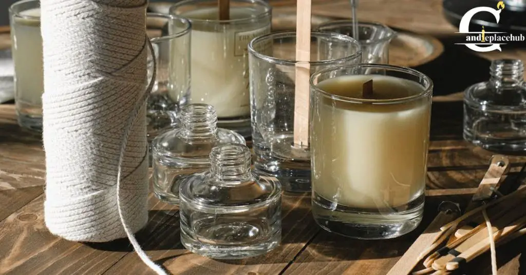 a braided cotton wick standing upright in a glass container candle.