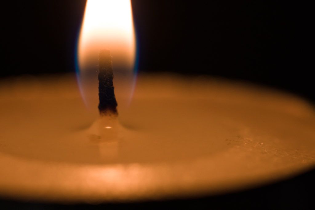 a close up photo of a finished candle with an embedded picture inside