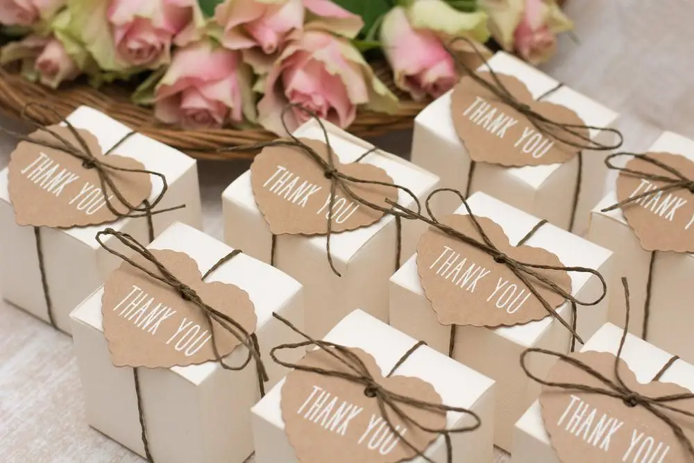 a couple exchanging wedding favors with guests