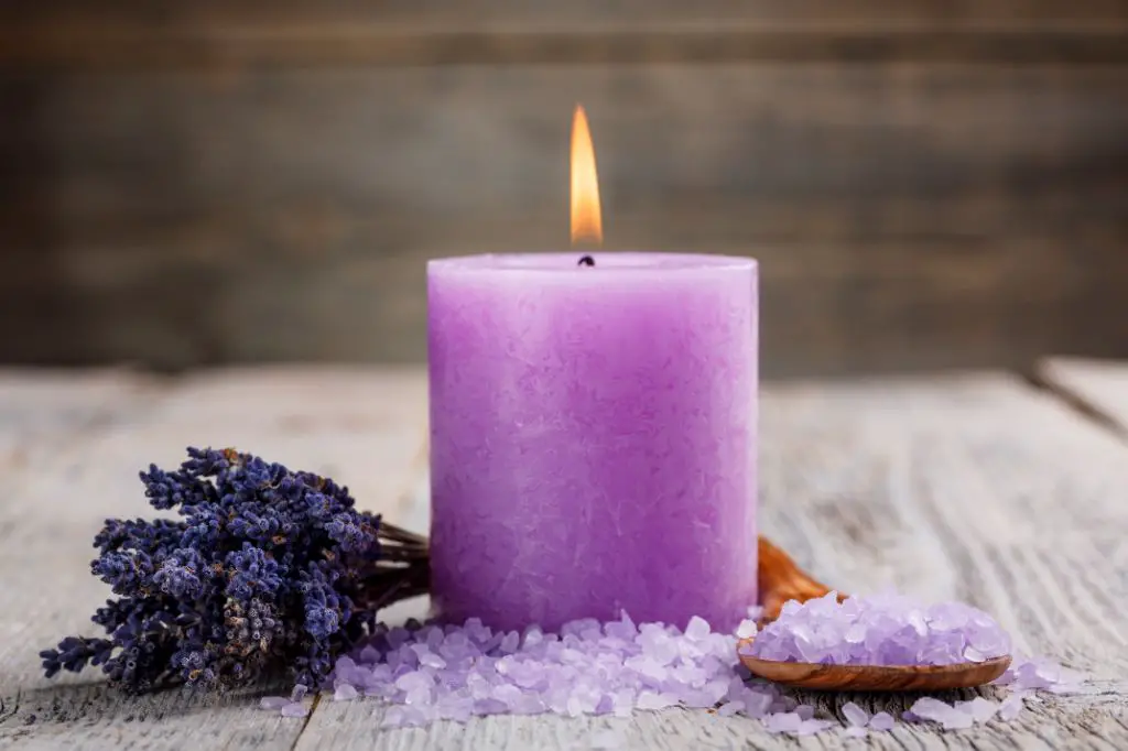 a lit lavender scented candle.