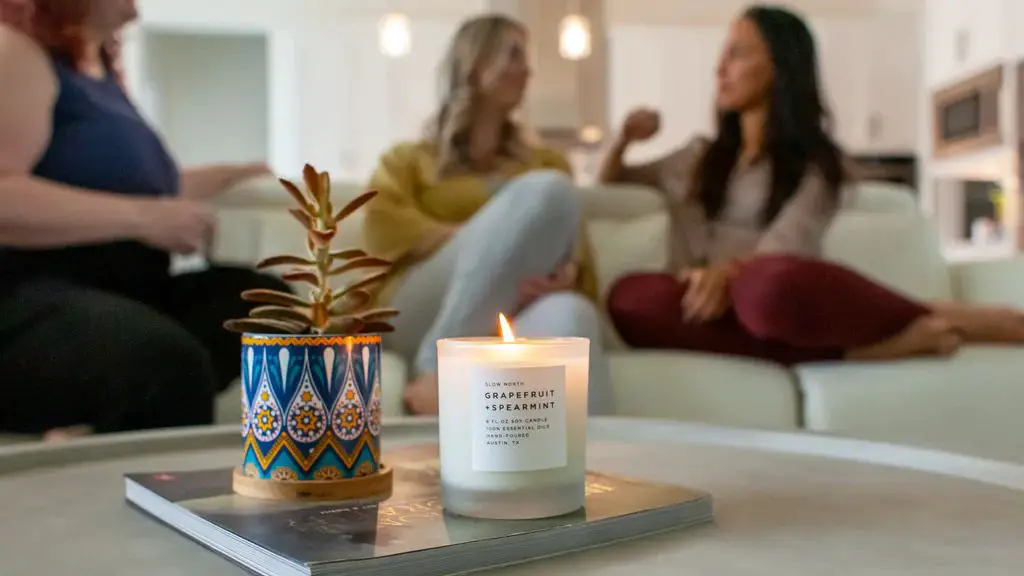 a person burning a soy candle