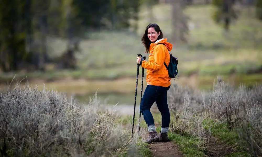 a person wearing wicking clothes while hiking in the outdoors.