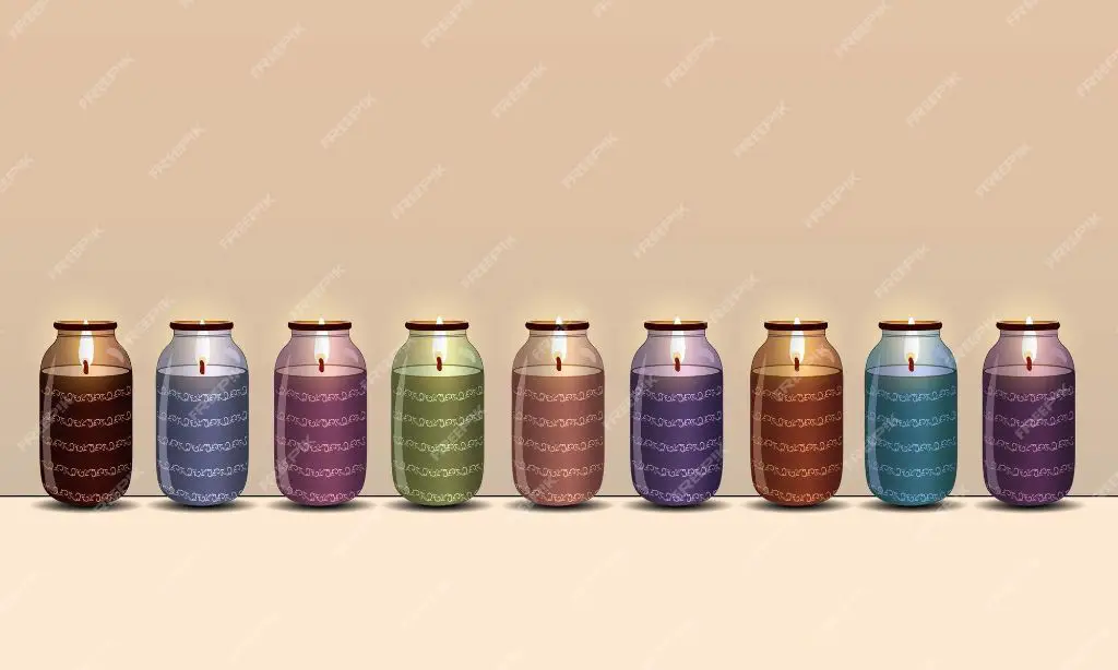 a row of jar candles in assorted colors and styles.