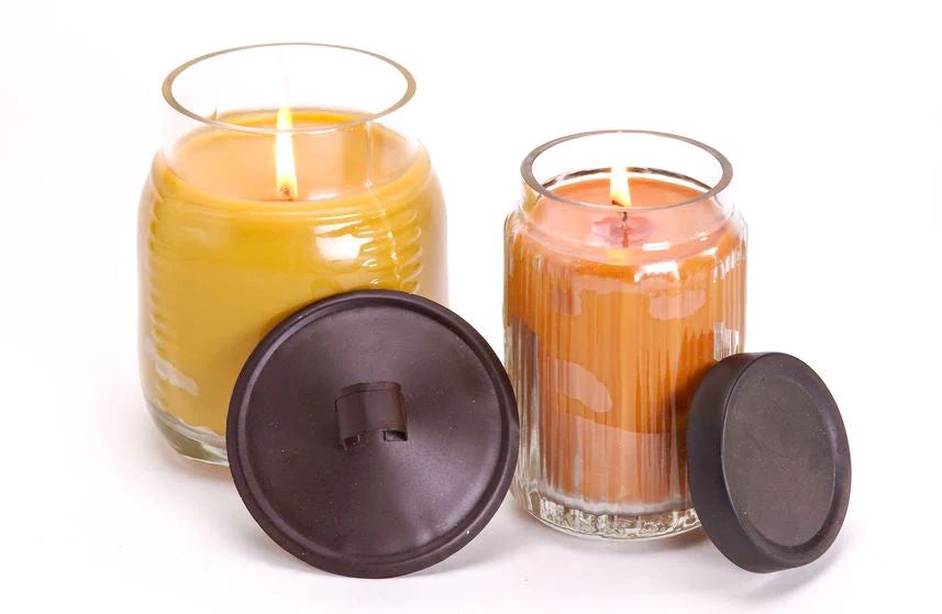 a spoon or knife can be used to scrape wax from the sides of a sunken candle and push it into the center tunnel.