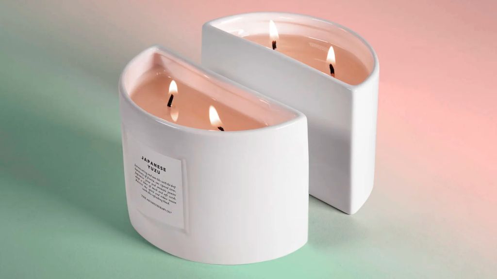 a variety of uniquely shaped candles with creative packaging.