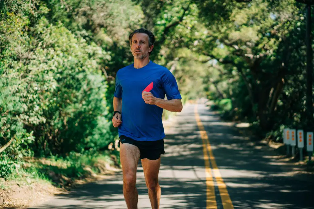 an image of a person wearing moisture wicking athletic clothes while running.