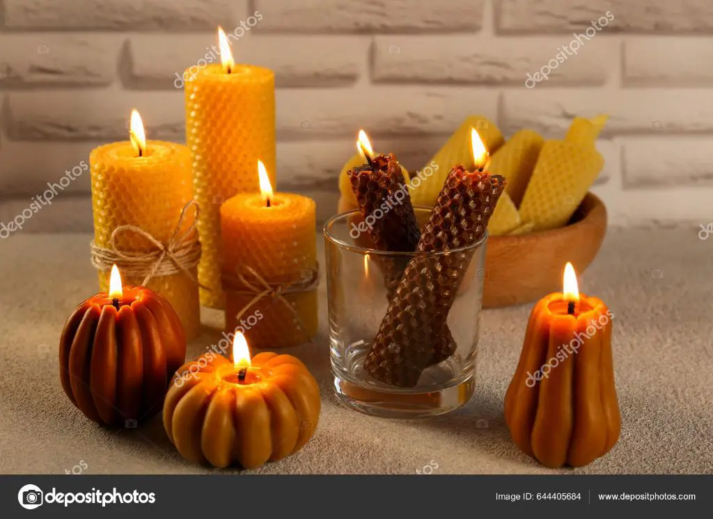 beeswax candles burning on a table