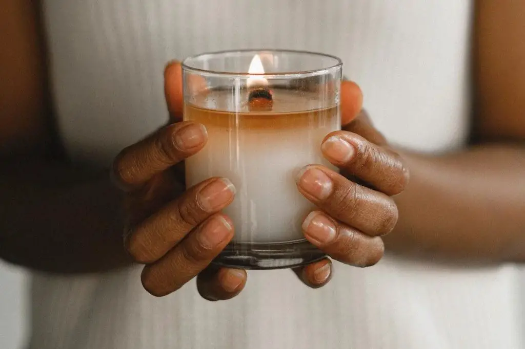 candle wax melting in a glass container, showing the ideal melt pool for even burning.