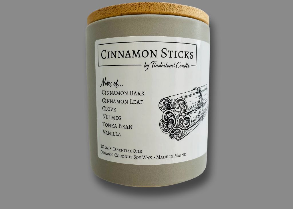 cinnamon sticks and vanilla beans infuse candles with natural spice scents.