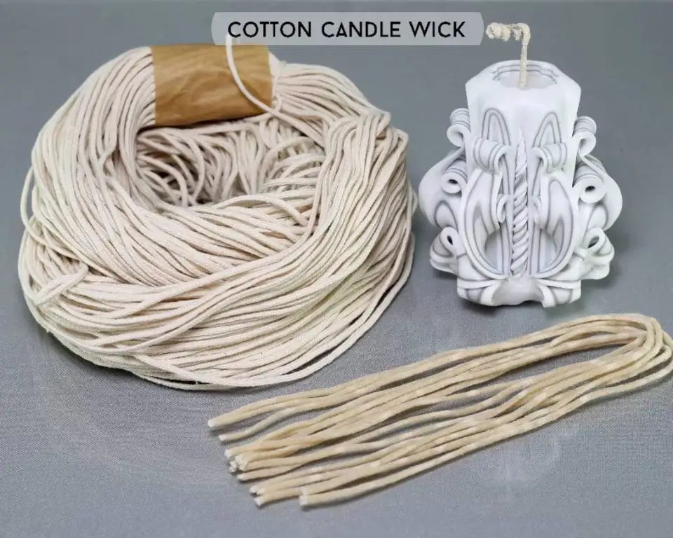close up photo of neatly coiled cotton candle wick cord.