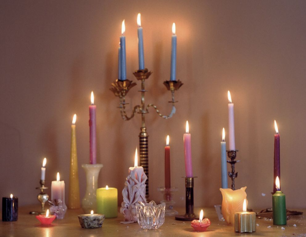 displaying tapered candles in candleholders creates an elegant look
