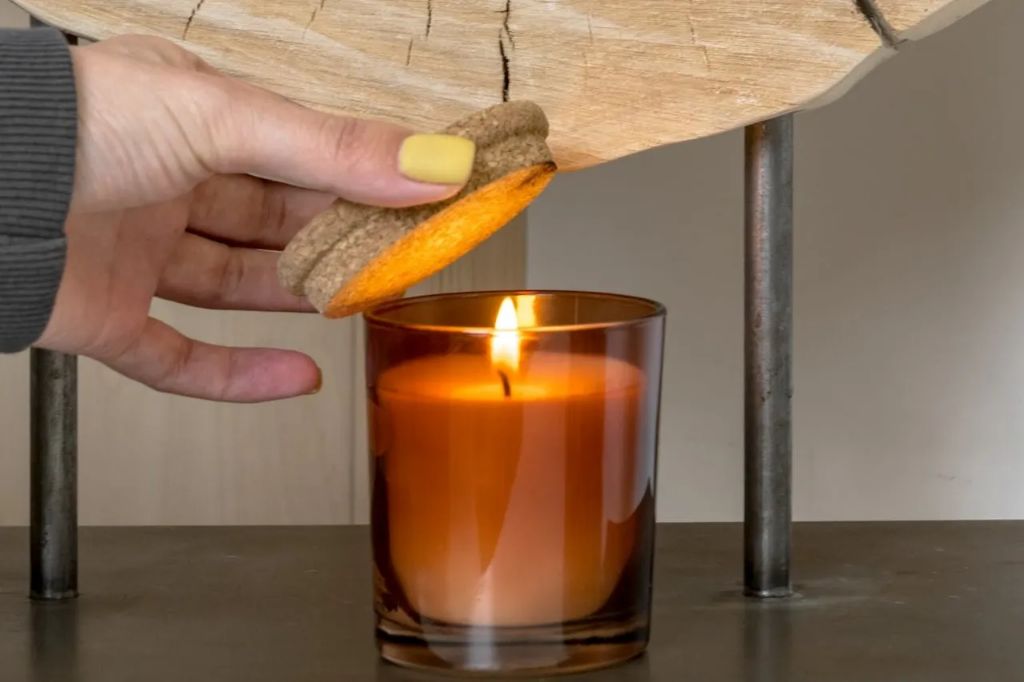 do not use a lid to extinguish a candle if the wax is still very hot or pooled.