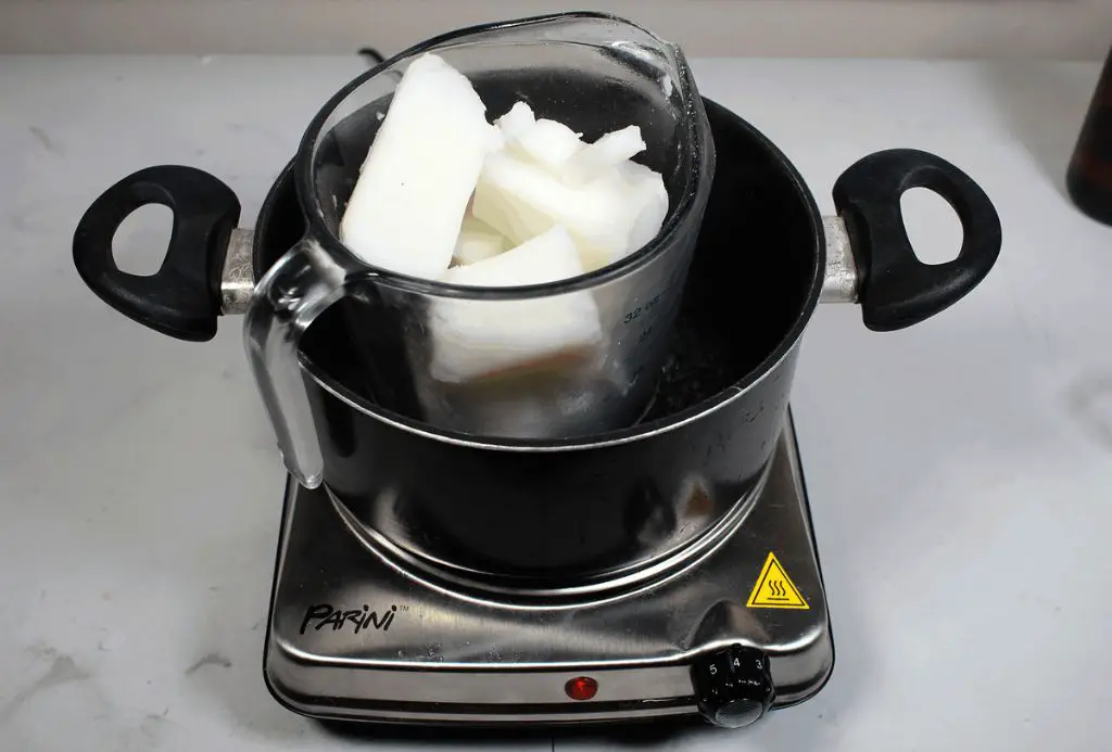 double boiler setup for melting wax using simmering water to gently heat wax.