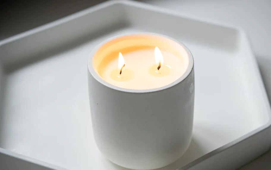 for a 4 inch diameter candle, you will typically want to use 2 wicks spaced a couple inches apart for even burning.