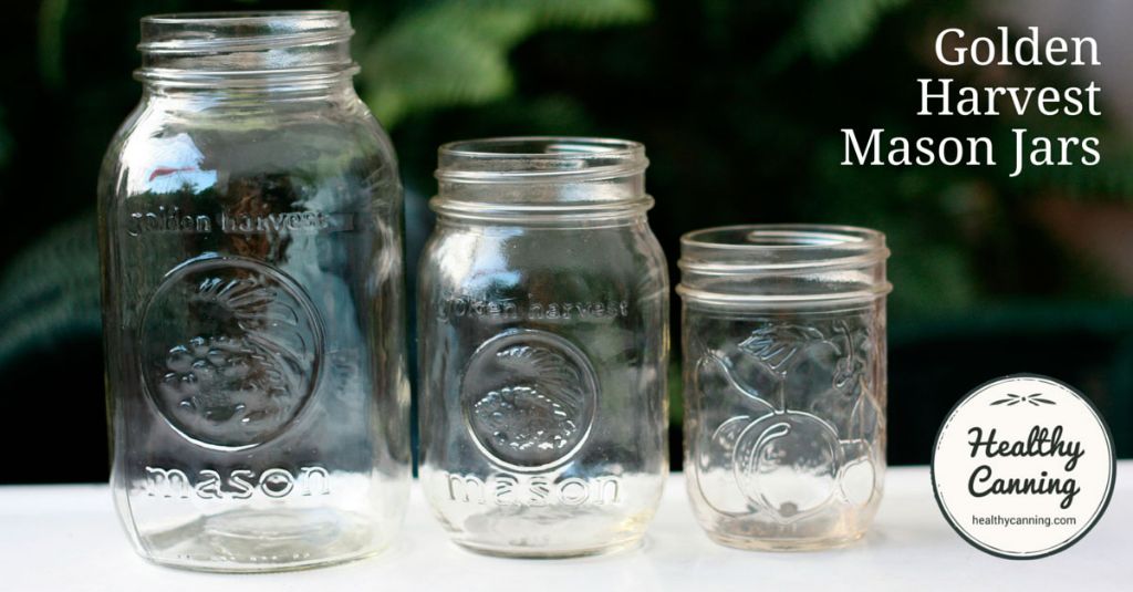 golden mason jars have embossed logos and molded designs