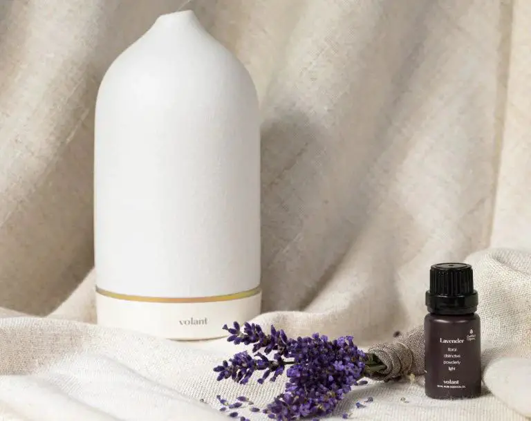 lavender essential oil being dropped into a diffuser