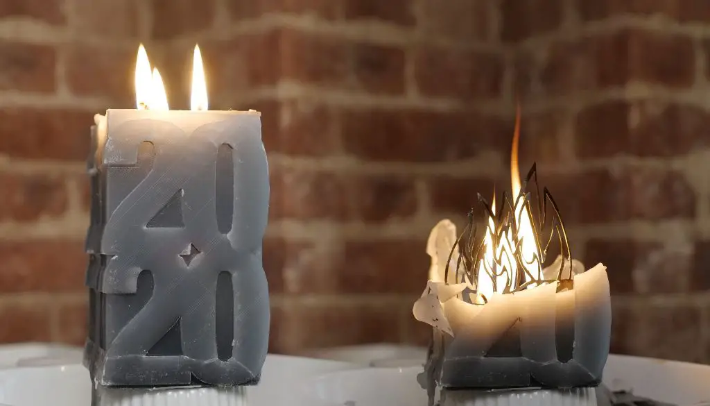 molten paraffin wax being poured into a candle mold