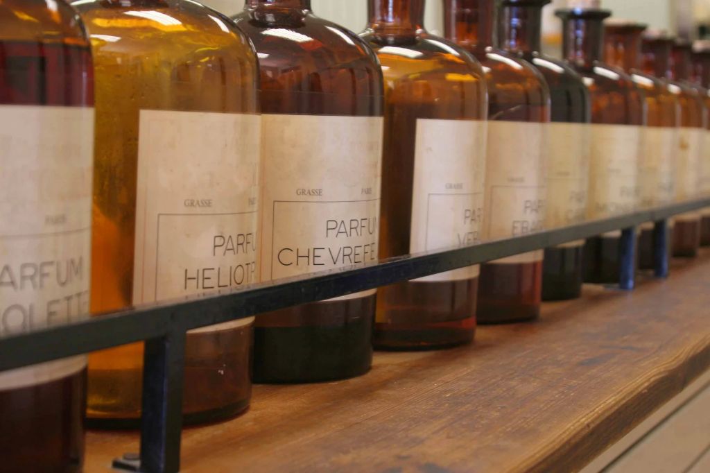 rows of fragrance oil bottles on shelves