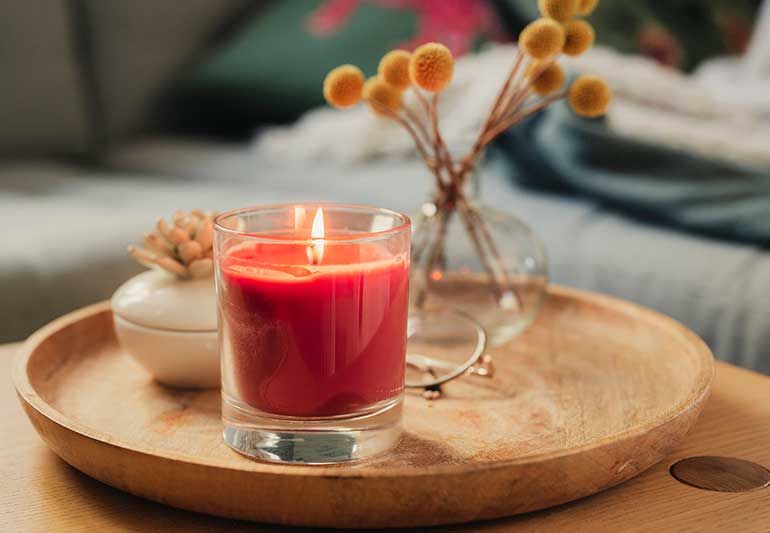soy wax candles burning on a table