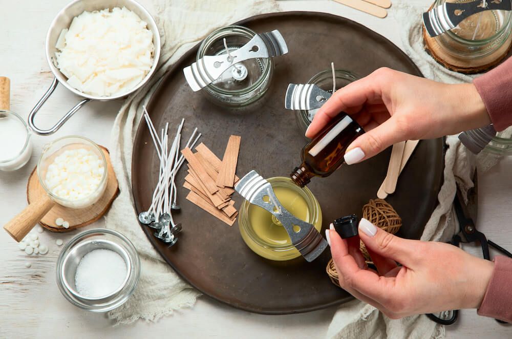 two fragrance oils being blended together when making candles