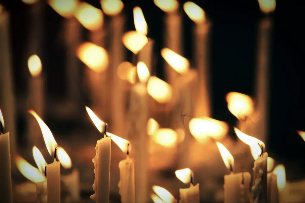 various candles burning with different size flames