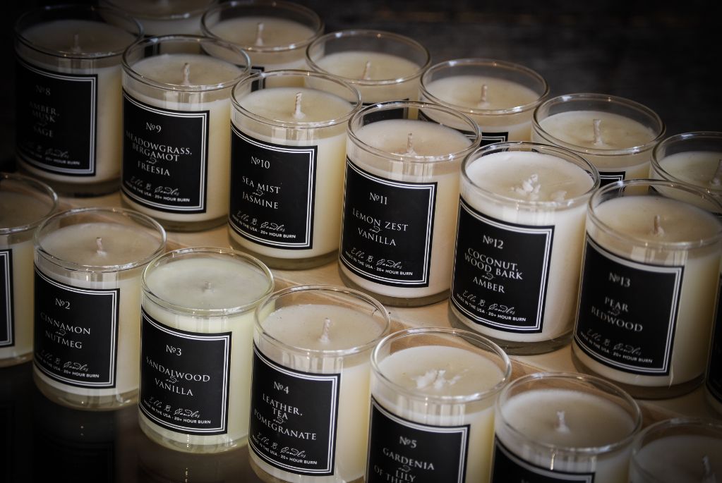 various scented candles on display in a store