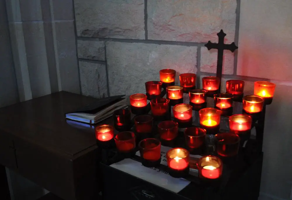 votive candles are commonly used in catholic churches as offerings before saints or religious imagery.