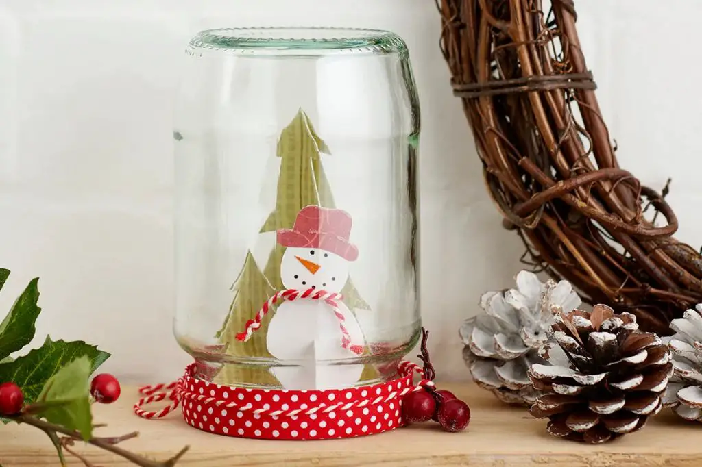 when gluing decorations, use a strong adhesive and press gently to attach embellishments to the glass.