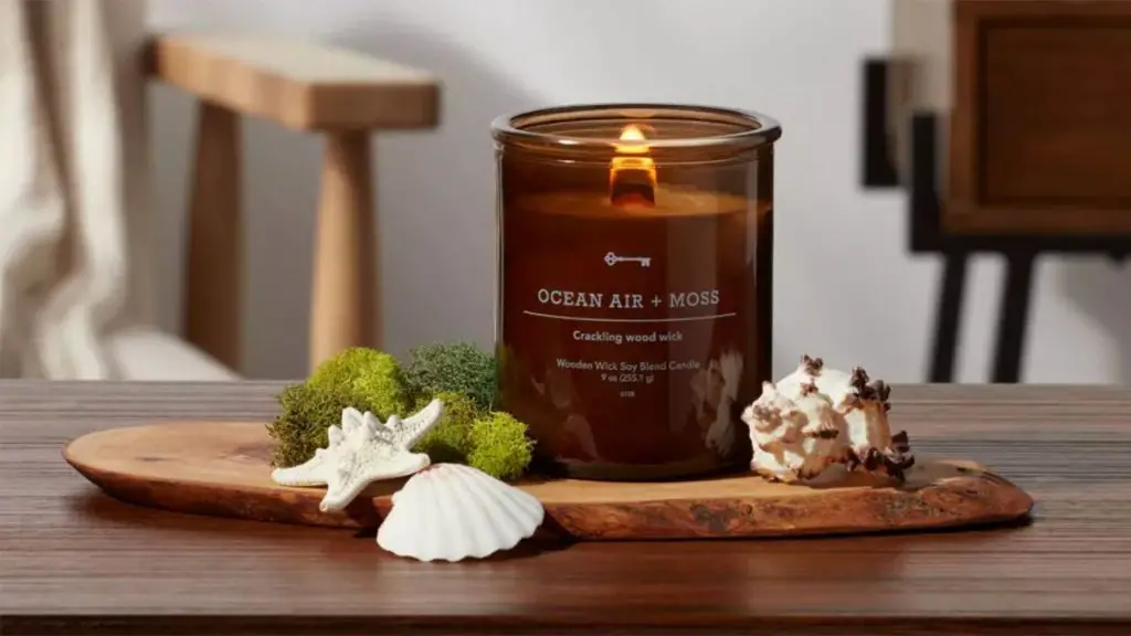 woman smelling a vanilla scented candle