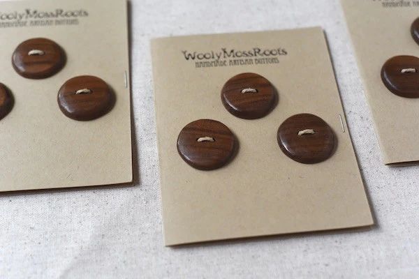 wood like maple and walnut are commonly used to make buttons.