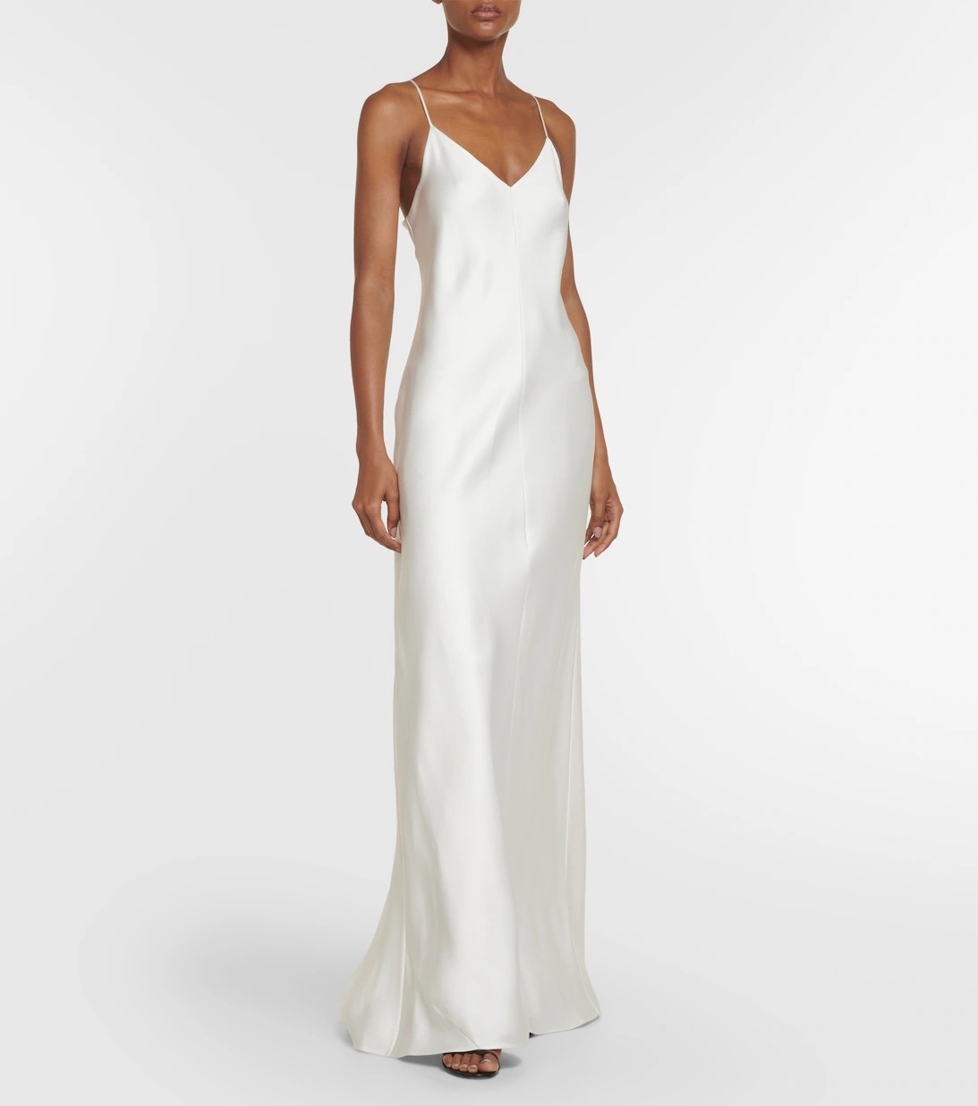 For a scenic beach wedding in a tropical town, shop this classic v-neck silk slip dress in pearlescent white. It’s breezy and summer-friendly, while still totally elegant.