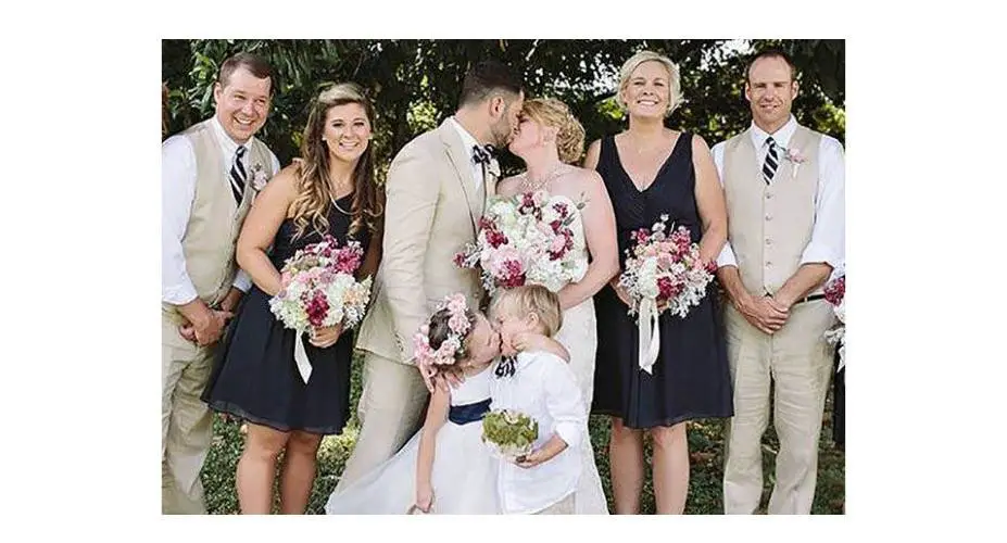 When the photographer said “I need the bride and the groom to kiss”, the flower girl (who apparently thought she was the bride all day) saw this as an opportunity to lean in and plant one on the ring bearer!