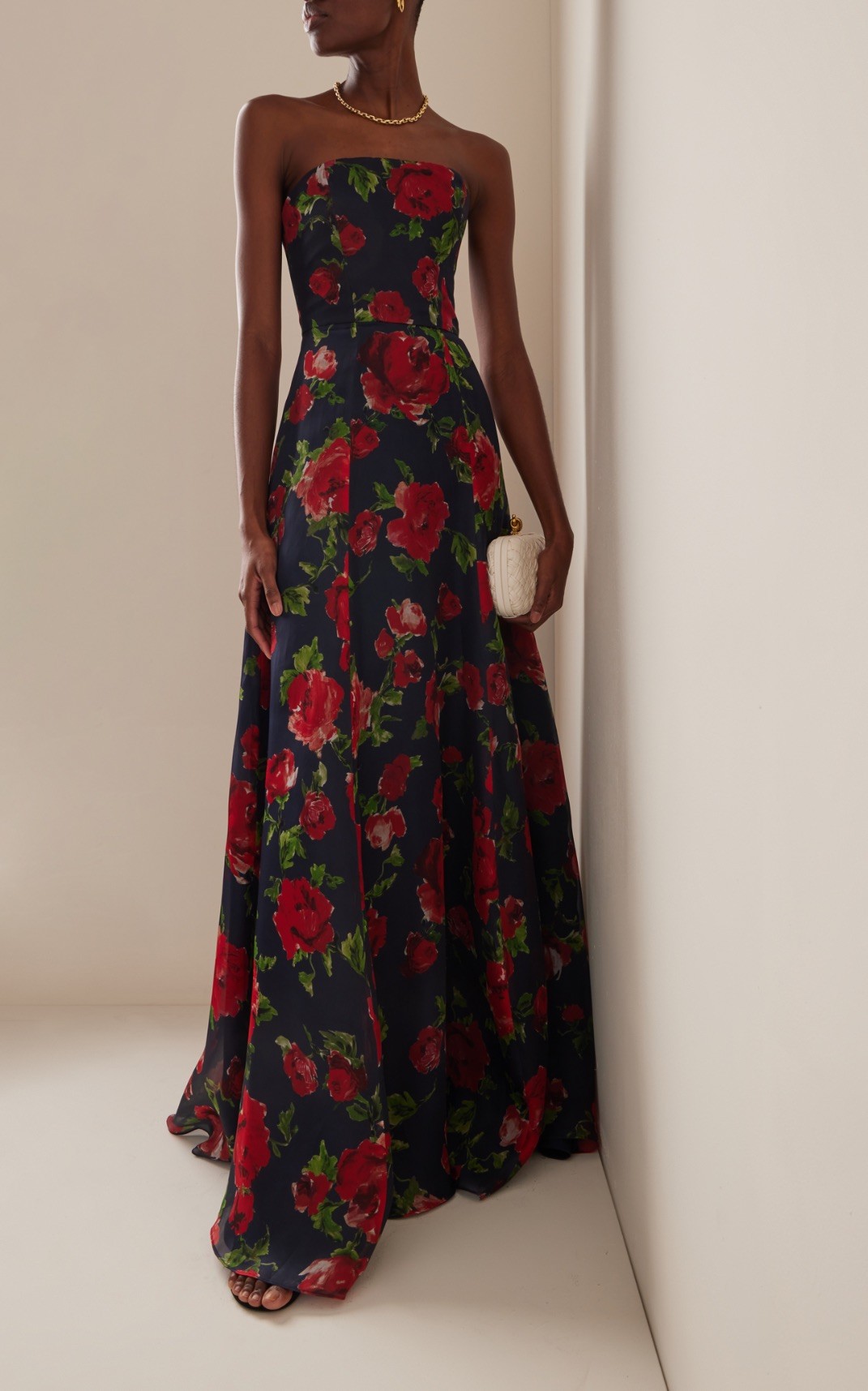 Floral prints in deep hues are exquisitely formal without ever being boring.  Style a strapless gown with a gold princess necklace and stud earrings to match.