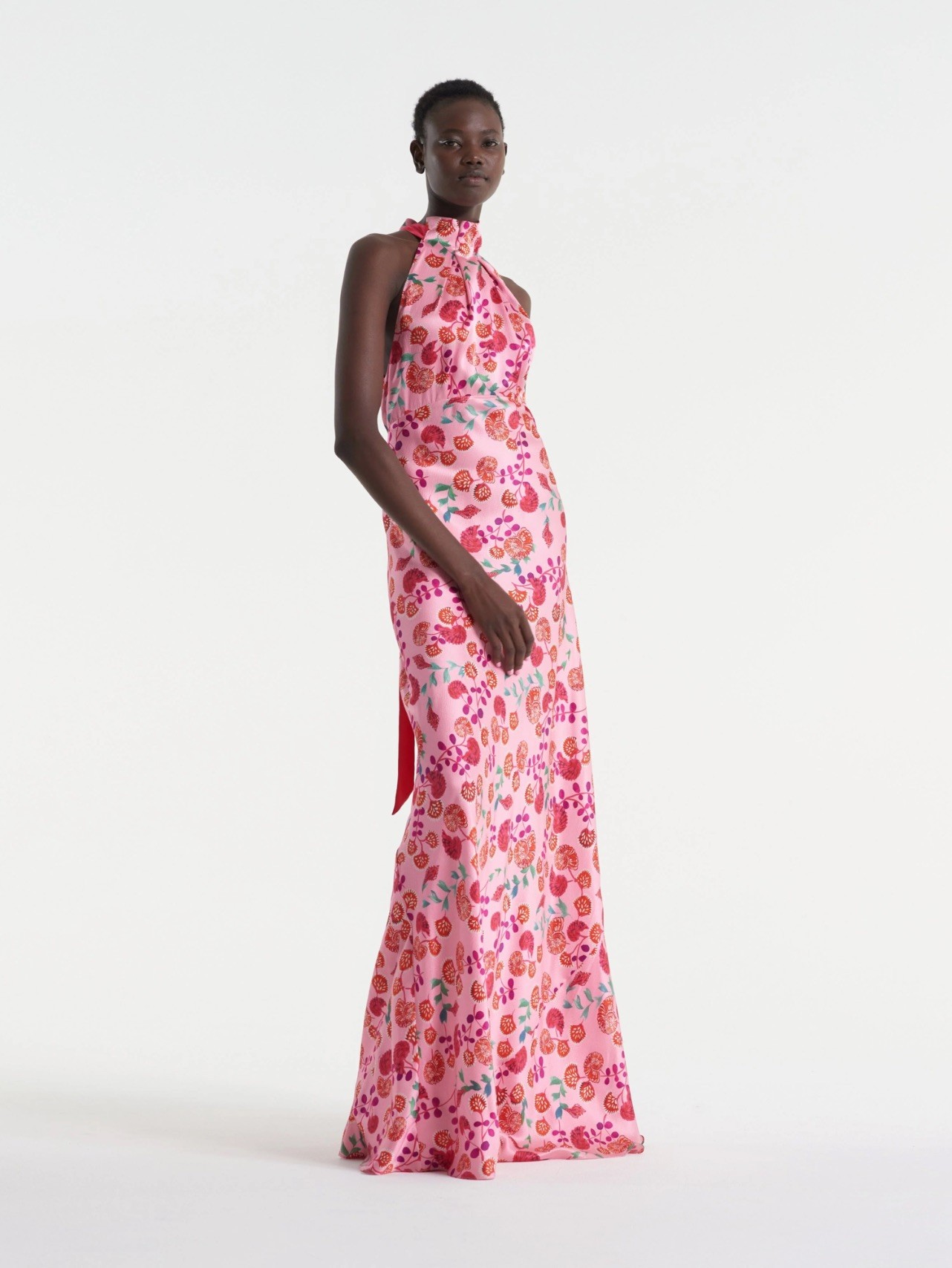 Not feeling the usual rosy blooms? Go for a quirkier print, like dandelions or cherries. A tie-back halter neckline offsets the animated print, giving the dress a more formal edge.