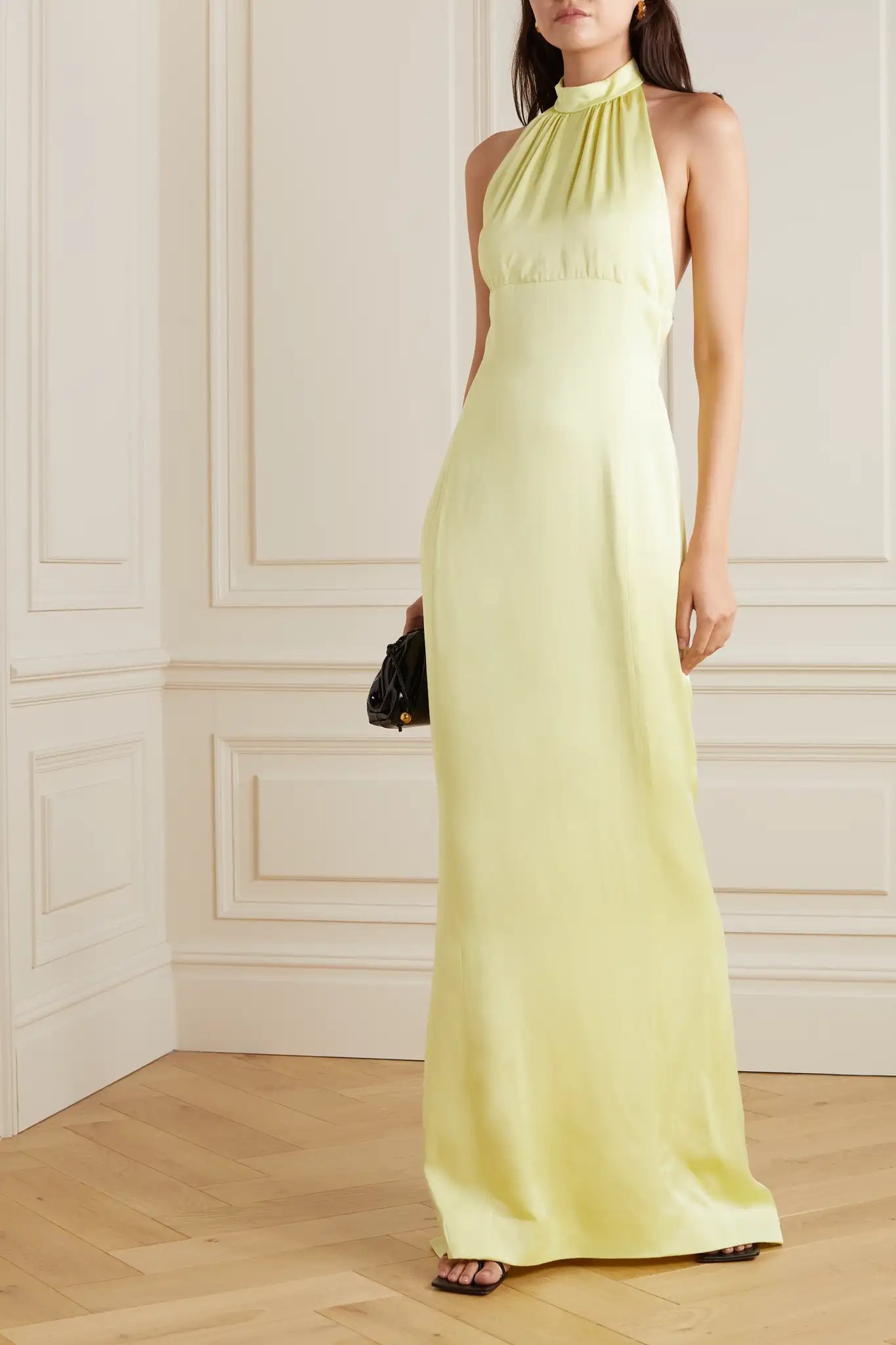 Effortlessly flattering without going overboard, a halter style dress is always a safe and elegant option. Slip into a column frock in a soft banana hue and brighten up any room.