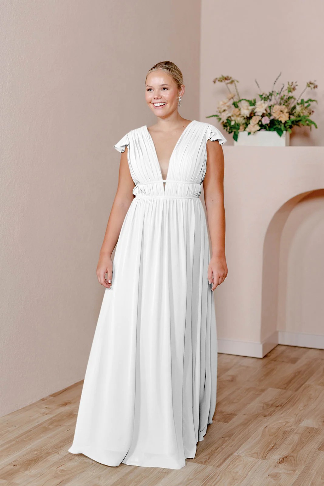 For beach weddings, wear a flowy gown with waistbands and a deep neckline.