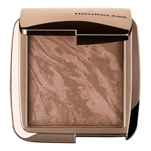 Skip harsh contouring. Instead, use a glowy bronzer and sculpt with blush.