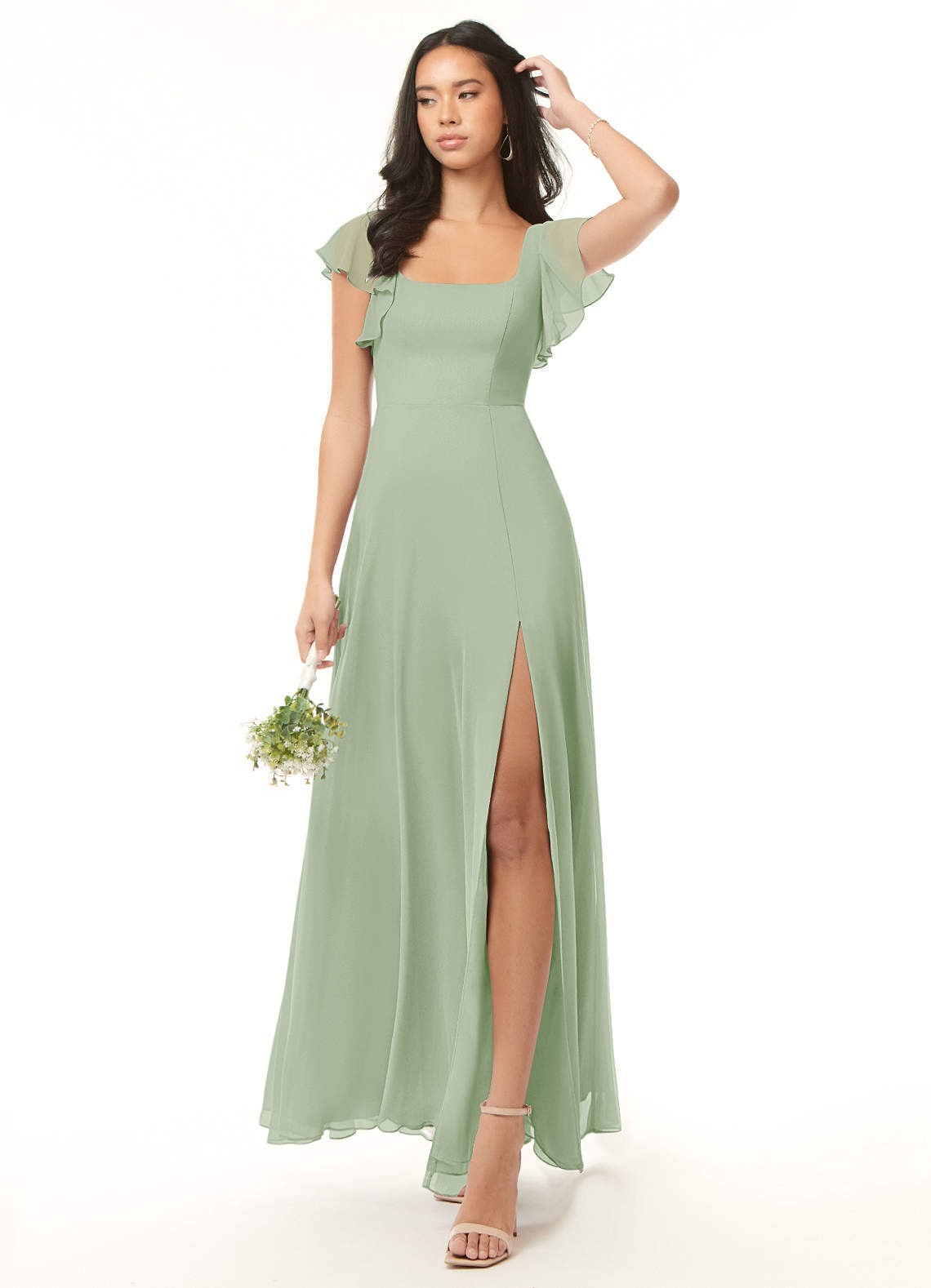 For a light and airy look, slip into a tea green frock with flutter sleeves, a square neckline, and a fitted waist that cascades into a chiffon maxi skirt.