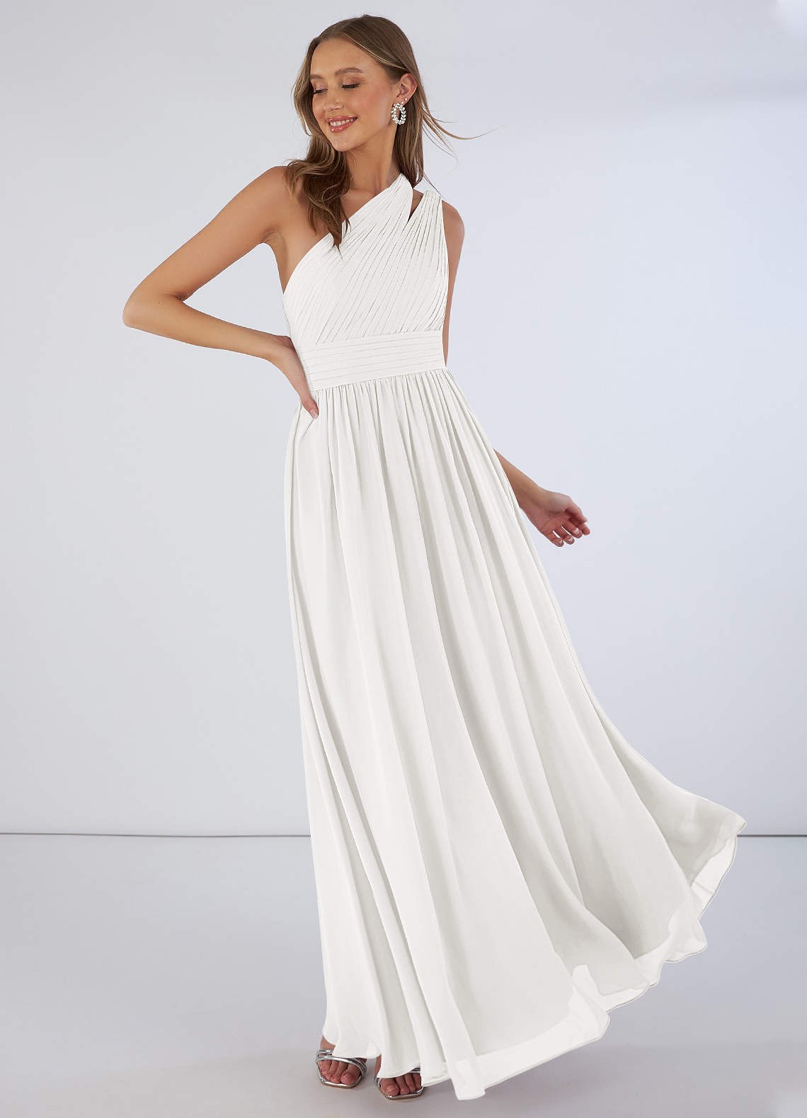 A draped one-shoulder gown will always be flattering! Wear this dress to a romantic chateau wedding.